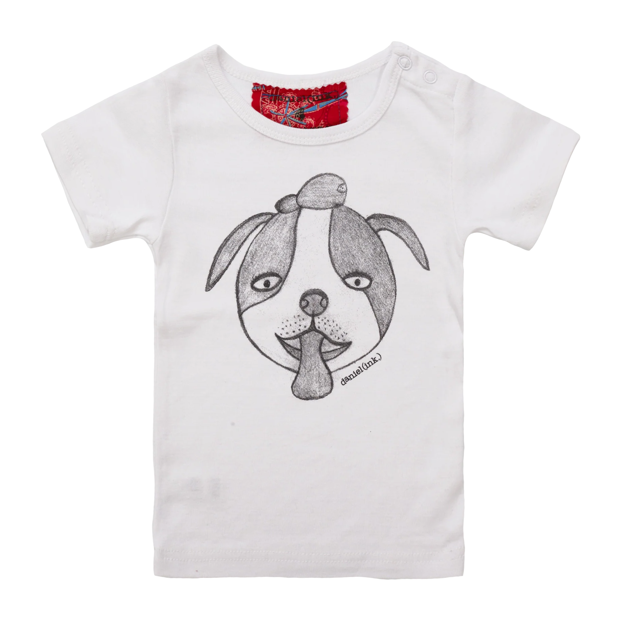 White short sleeve babies’ t-shirt featuring a hand drawn sketch of a dog’s face in black. The dog has a round head, floppy ears, wide eyes, and its tongue is sticking out. The t-shirt has a red fabric label on the back of the neck and has two white press studs on the left shoulder.