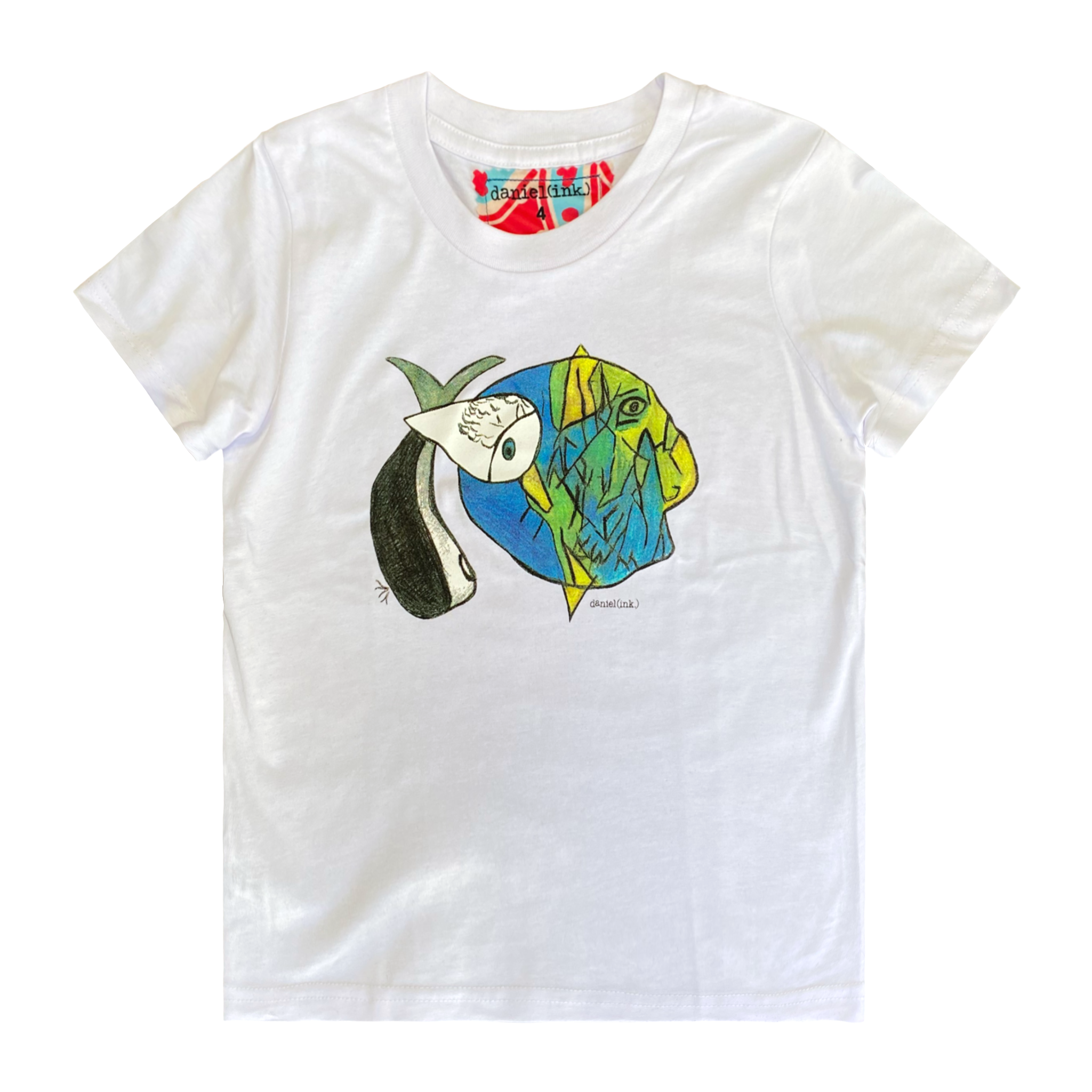 White kids' t-shirt featuring an abstract drawing of three fishes swimming together. The design features a large yellow, green, and blue fish on the right; a small grey fish in the middle; and another larger grey and white fish on the left. This t-shirt has a red, white, and blue fabric label on the back of the neck.