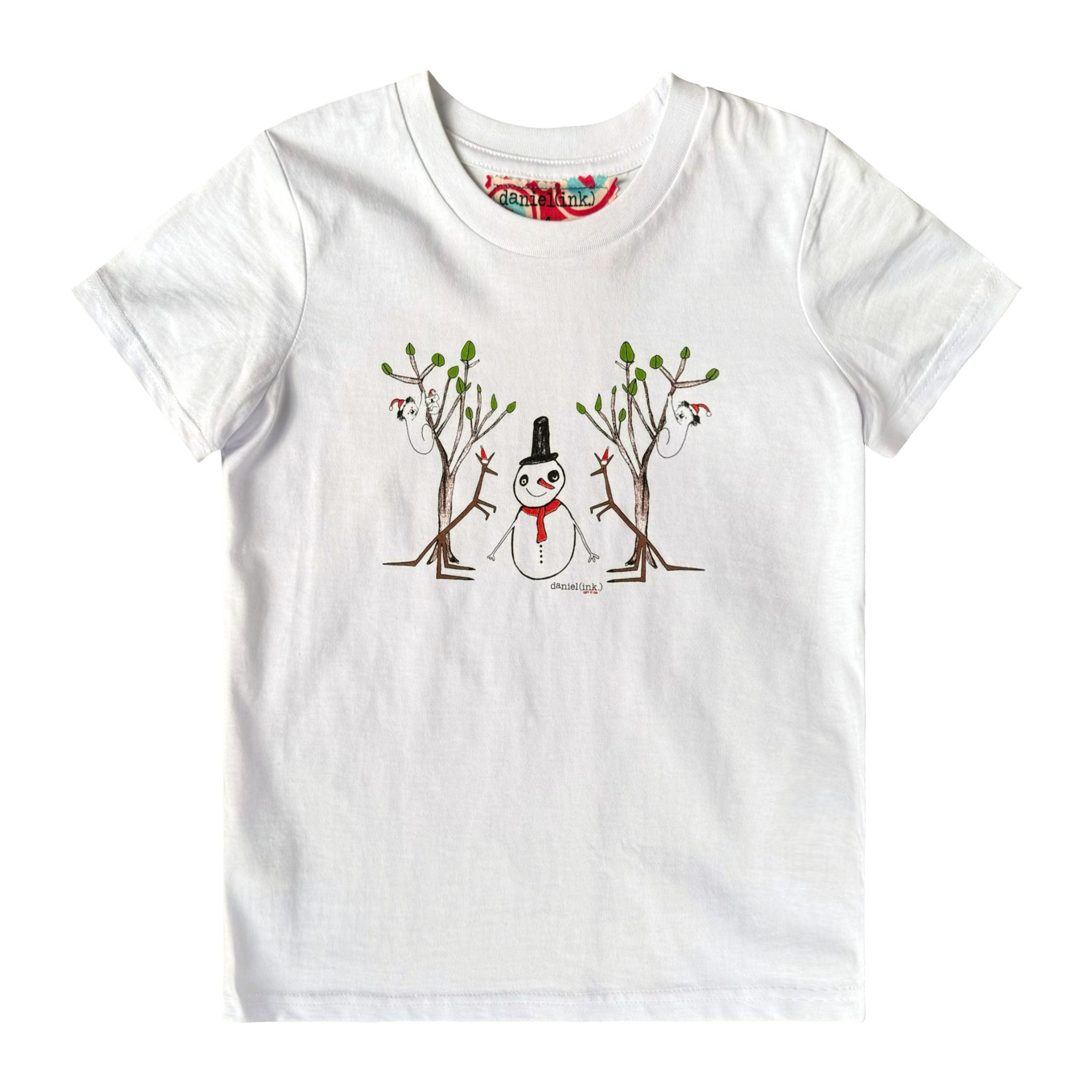 White kids' t-shirt featuring a hand drawn image of a snowman standing in between two kangaroos and in front of two large gum trees. The snowman is wearing an orange scarf and black top hat and the kangaroos are both wearing pointy Santa hats. The gum trees both have koalas wearing Santa hats in them. This t-shirt has a red, white, and blue fabric label on the back of the neck.