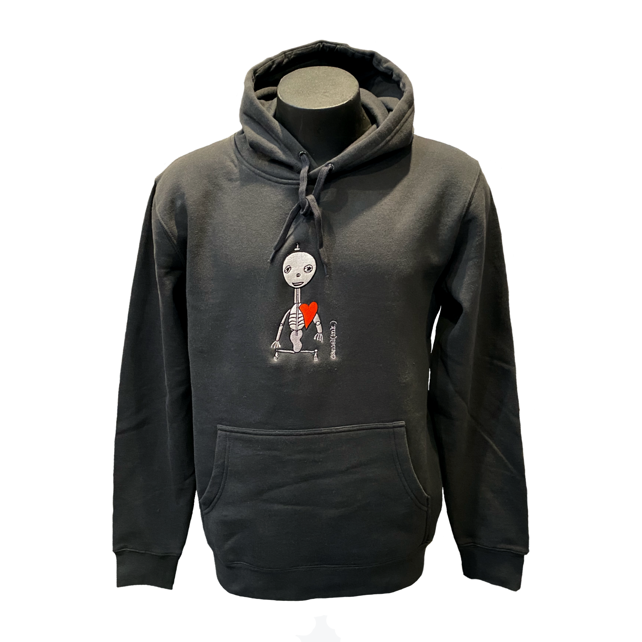 Unisex coal hoodie featuring an embroidered image of a silver skeleton with a red heart. The name daniel(ink.) is embroidered in silver thread next to the skeleton.