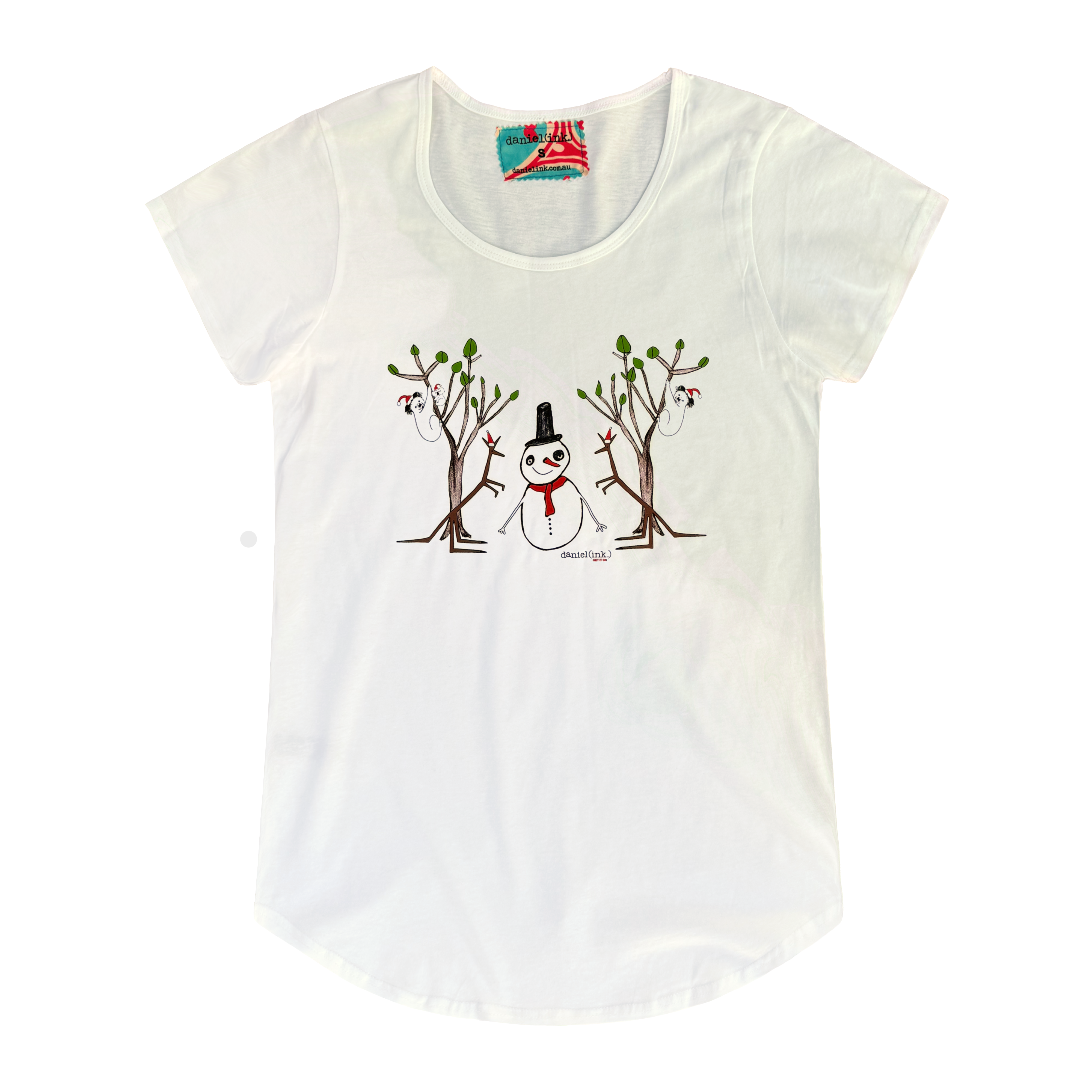 Women's white t-shirt featuring a hand drawn image of a snowman standing in between two kangaroos and in front of two large gum trees. The snowman is wearing an orange scarf and black top hat and the kangaroos are both wearing pointy Santa hats. The gum trees both have koalas wearing Santa hats in them. This t-shirt has a red, white, and blue fabric label on the back of the neck.